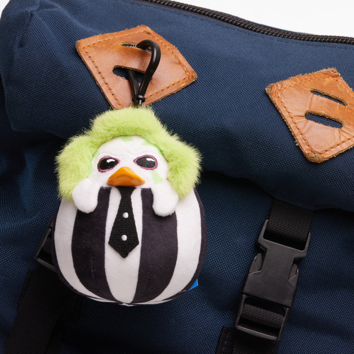 TUBBZ Beetlejuice plush bag charm keychain shown as a bag accessory