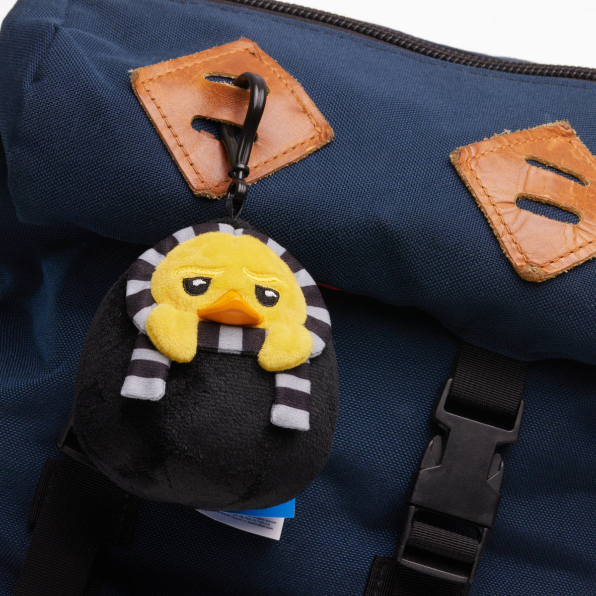 TUBBZ Gru plush bag charm keychain shown as a bag accessory